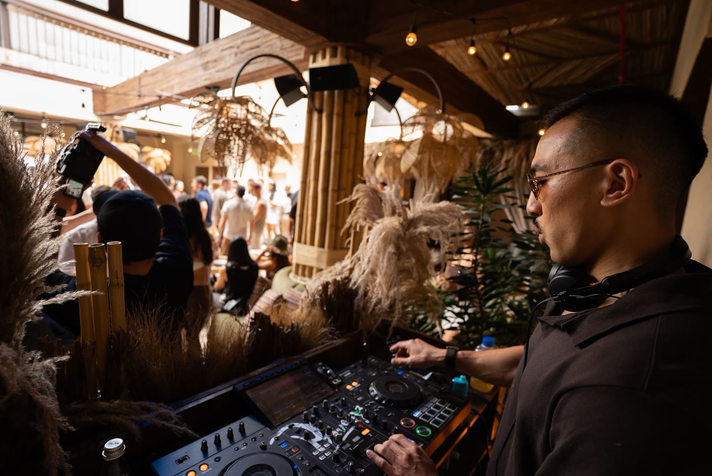 Sean Chi DJing at an outdoor garden event