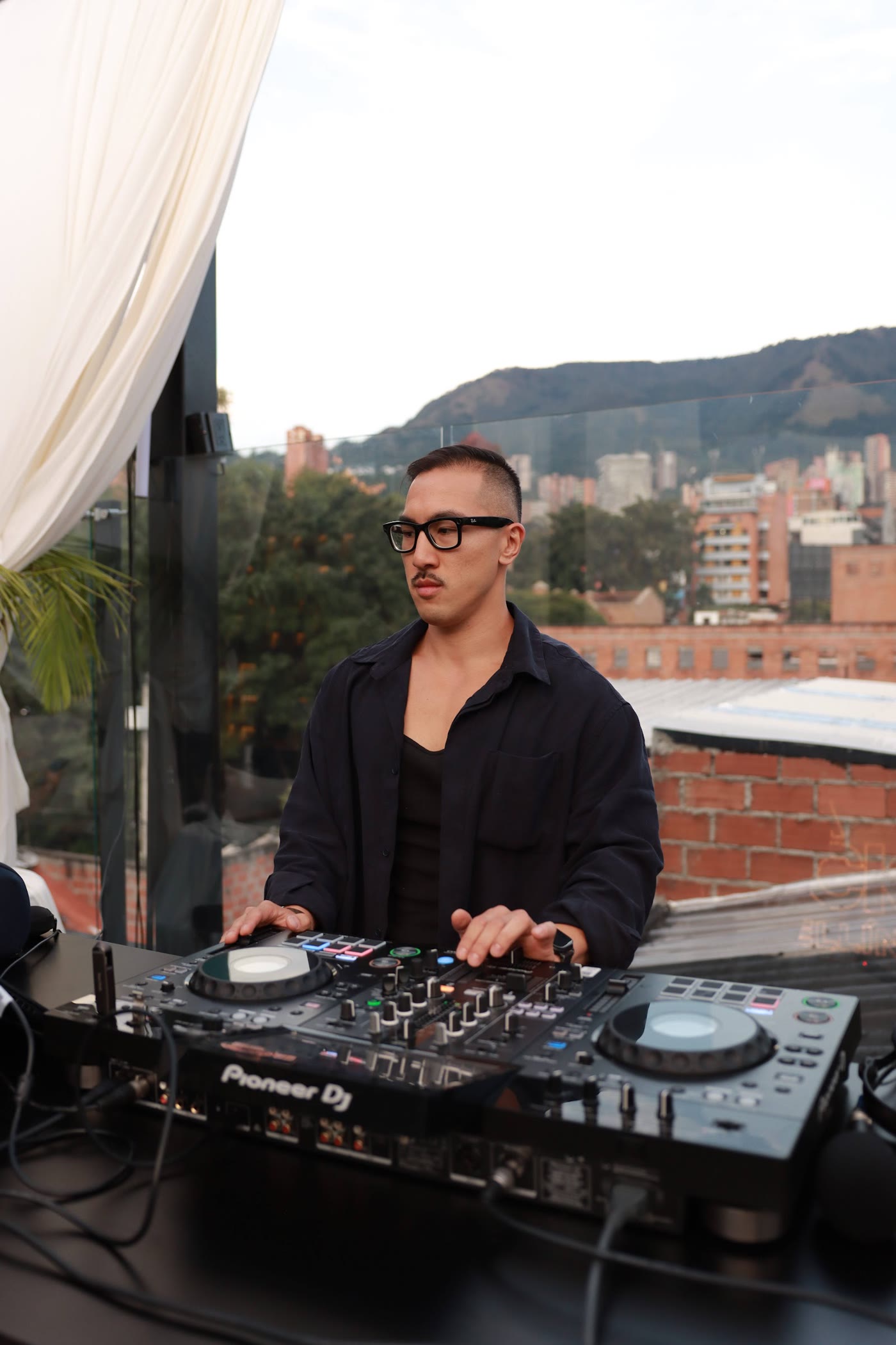 Sean Chi on a rooftop set in Medellín
